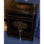 A late Victorian ebonised cased Tantalus, the outer panels with boulle work decoration and keys