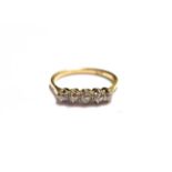 A diamond five stone ring, stamped '18CT', finger size Q. Gross weight 2.8 grams.