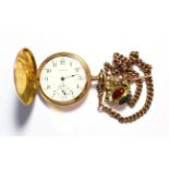 A gold plated pocket watch with attached watch chain stamped '9C' with hardstone fob