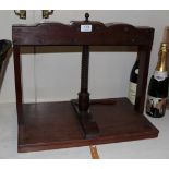 An early 19th century mahogany press with turned handle