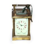 A brass striking carriage clock, circa 1900, enamel dial with Roman numerals and with swag floral