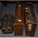 Two leather suitcases and a Gladstone bag