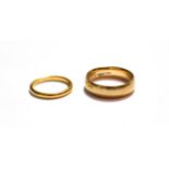 A 9 carat gold band ring, finger size T; and a 22 carat gold band ring, finger size L1/2. 9 carat