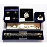 A Swarovski necklace and bracelet suite; a Swarovski necklace, earring and ring suite; and two