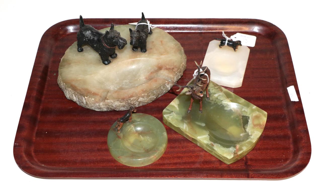 Three bronze mounted onyx dishes and a spelter terrier mounted ashtray (4)