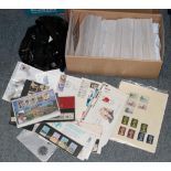 A box and a plastic bag containing Worldwide stamps in envelopes; mixed stamps; presentation