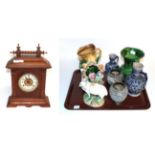 An oak cased Ansonia striking mantel clock; green glaze Toby jug; a pair of squat vases initialled