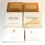Four assorted Estée Lauder solid perfume compacts, comprising 'Petit Four'; 'Drop of Intuition'; '