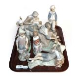 Lladro figure groups and one other (7)