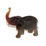 A Daum pate-de-verre elephant, incised 'Leroy', modelled standing with trunk raised, 15cm long, with