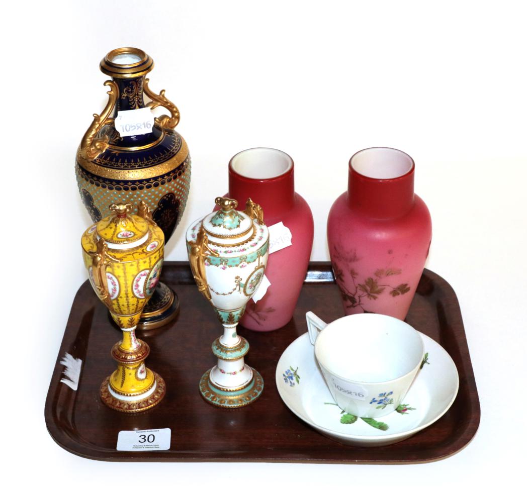 A pair of Royal Crown Derby gilt handled pedestal vases with covers; a larger Coalport blue and gilt