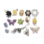 Various silver gem set pendants and brooches, including a tanzanite owl pendant and a peridot