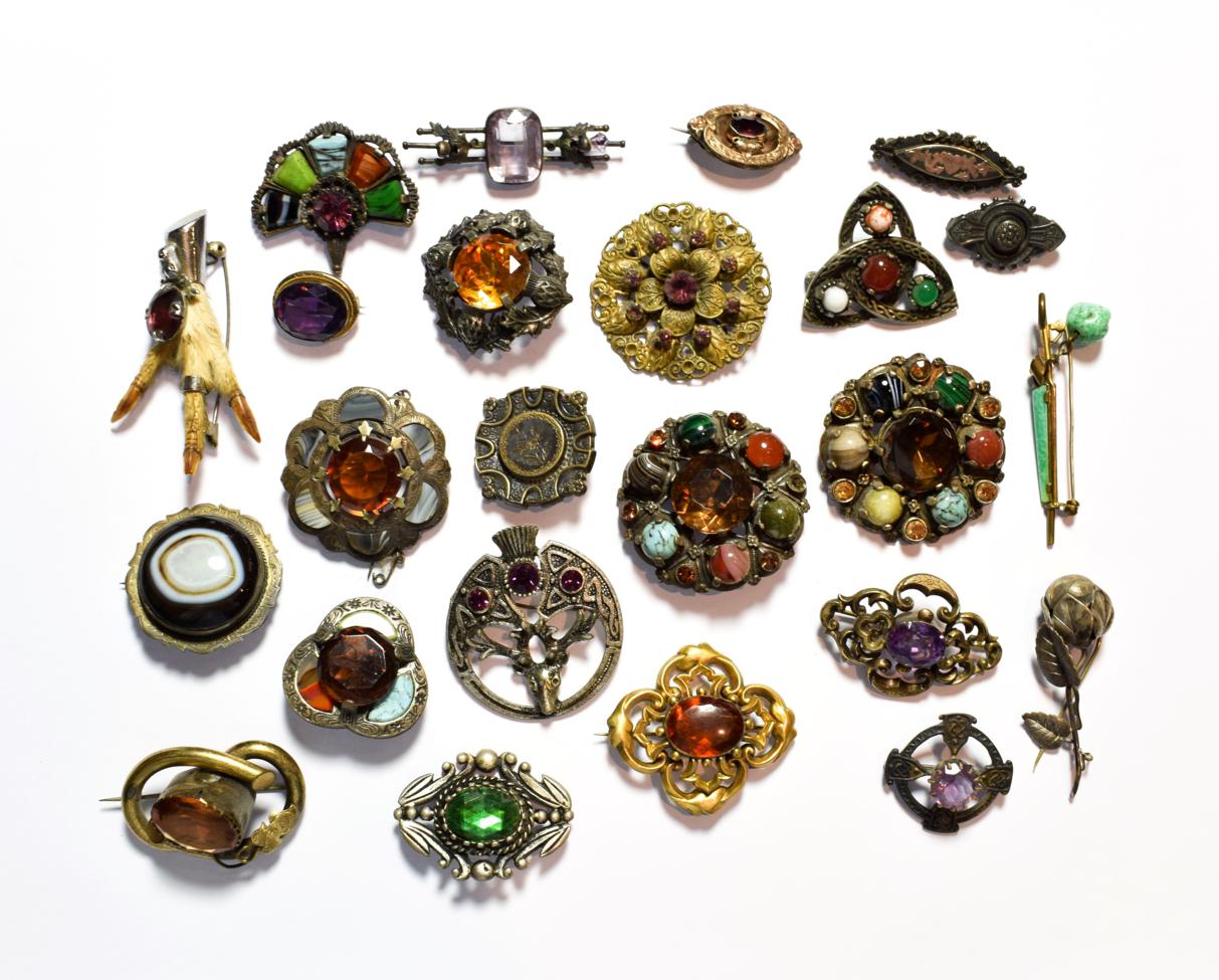 A collection of Scottish hardstone brooches; silver brooches etc