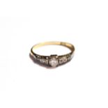 A diamond solitaire ring with diamond set shoulders, stamped '18CT', finger size N1/2. Gross