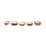 A textured 9 carat gold ring, finger size P; a 9 carat gold amethyst and seed pearl ring, finger