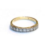 A diamond nine stone ring, stamped '18CT & PLAT', finger size P. Gross weight 4.1 grams.