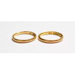 Two 22 carat gold band rings, finger sizes L and M. Gross weight 5.4 grams.