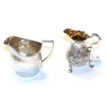 A George II and a George III silver cream-jug, one London 1809, helmet-shaped and with Greek-key