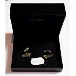 A pair of Lalique cufflinks, in the form of Victoire hood ornaments, boxed . The cufflinks are in