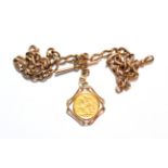 A 1910 full sovereign mounted as a pendant on chain, each link stamped '9' and '.375'. Gross
