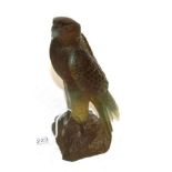 A Daum pate-de-verre Falcon, modelled perched on a rock, dated 2003, 337/1000, 22cm high, with