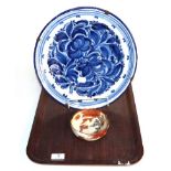 A Delft blue & white charger, floral pattern, marked 'W.M.D.' to underside, 34.5cm diameter;