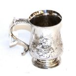A George III silver mug, unidentified makers mark J.S, London 1771, baluster and on spread foot,