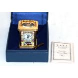 A Halcyon Days enamel miniature carriage clock (boxed)