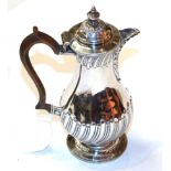 A Victorian silver hot-water jug, by Henry Stratford Ltd., London, 1894, pear-shaped, the rim and