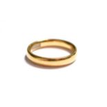 An 18 carat gold band ring, finger size P. Gross weight 5.4 grams.