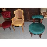 A Victorian nursing chair upholstered in red velvet; a Victorian chair upholstered in green