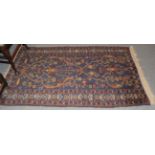 A good Turkish rug of star Kazak design, the straw field with two stellar medallions surrounded by