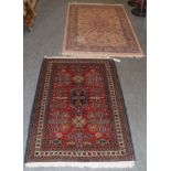 An Afghan Ziegler rug, the terracotta field of scrolling vines enclosed by meandering vine