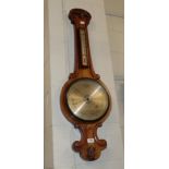 A Victorian carved mahogany wheel barometer; a Victorian mahogany dressing mirror (a.f.); and an oak