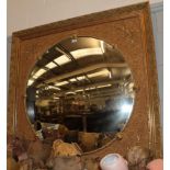 A Gilt Overmantel Mirror, the circular plate within a ropetwist border divided by lion masks, the