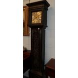 A carved oak eight day longcase clock, dial chapter ring bearing a later inscription, Reeves,