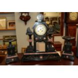 A black slate and marble striking clock garniture, circa 1878