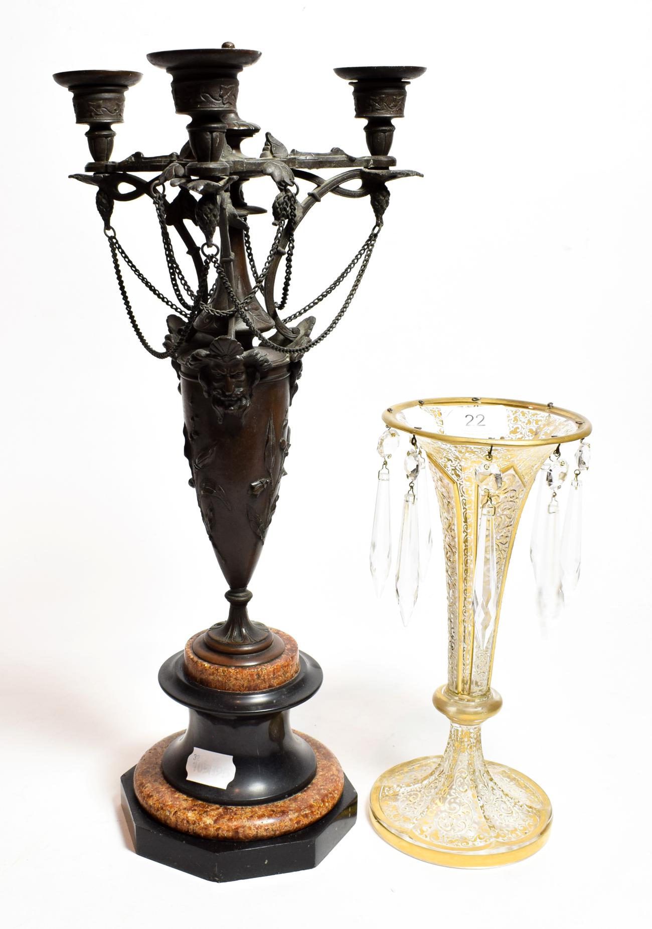 A 19th century bronze three light candelabra on a circular rouge marble and slate base, together