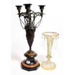A 19th century bronze three light candelabra on a circular rouge marble and slate base, together