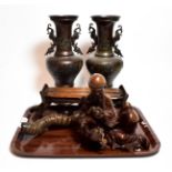 Japanese items including a pair of bronze vases; a headrest; a rootwood figure; and a horn (5)