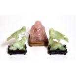 A pair of Chinese green hard stone models of birds, together with a Chinese pink quartz model of a