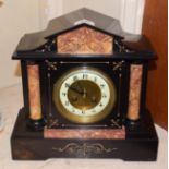 A Victorian black slate and marble striking mantel clock, circa 1870