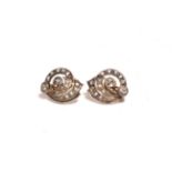 A pair of diamond cluster earrings, the scroll motif set throughout with rose cut and old cut