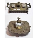 A large 19th century silver plated repousee deskstand, in the manner of Elkington, the glass inkwell