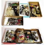 A quantity of costume jewellery in four large boxes