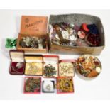 A quantity of costume jewellery including beaded necklaces, brooches, an amber type bracelet, a