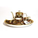 A miniature Royal Crown Derby Imari pattern tea set, number 1128