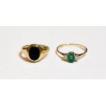 A 9 carat gold emerald and diamond three stone ring, finger size Q; and a 9 carat gold bloodstone