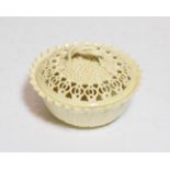 A Leeds pottery reticulated creamware bowl and cover, strap work handle, stamped