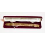 A 9 carat gold brick link bracelet, length 19cm . Gross weight 44.8 grams.